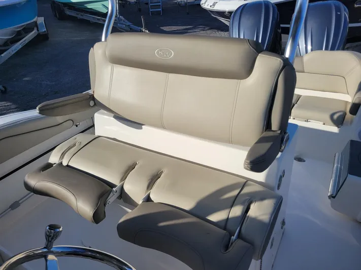  Yacht Photos Pics 2022 Key West 263 FS boat seating with beige upholstery and steering wheel.