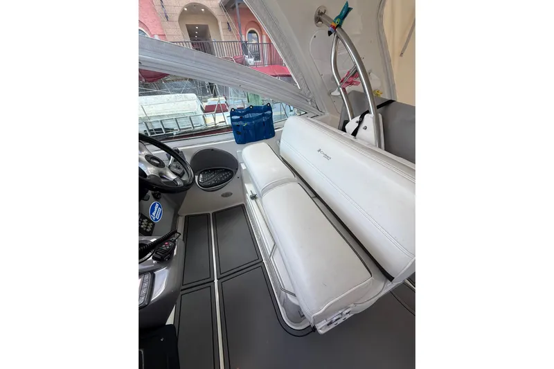  Yacht Photos Pics 2005 Cruisers Yachts 420 Express interior with white seating and helm controls.