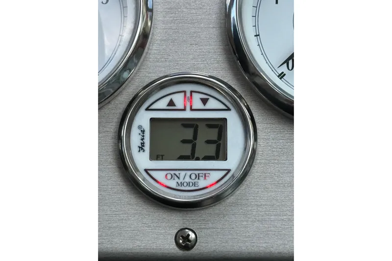  Yacht Photos Pics Digital depth gauge reading 3.3 feet on a 2005 Cruisers Yachts 420 Express.