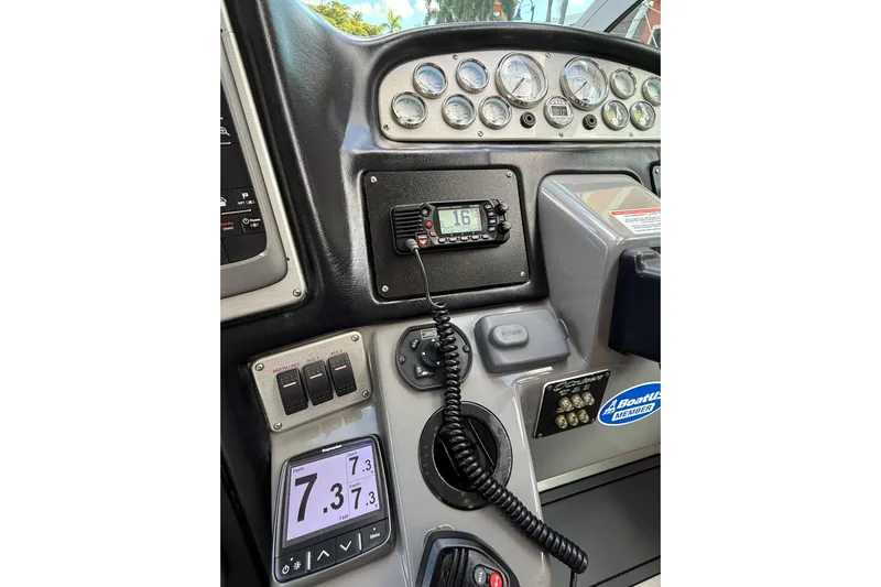  Yacht Photos Pics 2005 Cruisers Yachts 420 Express dashboard with gauges and communication equipment.