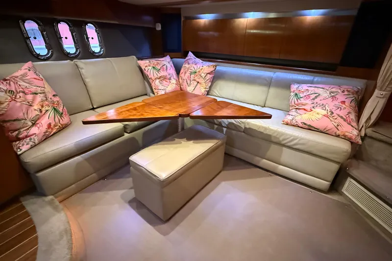  Yacht Photos Pics Luxurious interior of 2005 Cruisers Yachts 420 Express with plush seating and decorative pillows.