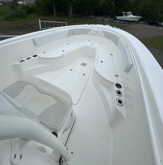  Yacht Photos Pics 2013 Edgewater 318CC boat interior with white seating and spacious deck.