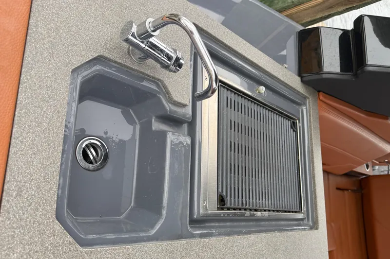 Kailani II Yacht Photos Pics 2023 Cruisers Yachts 34 GLS OB boat sink and grill setup.