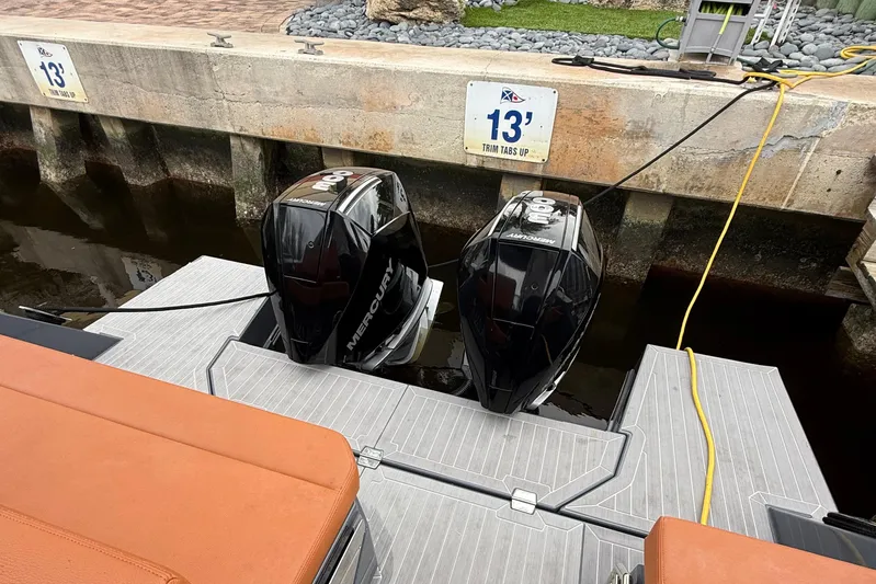 Kailani II Yacht Photos Pics 2023 Cruisers Yachts 34 GLS OB with dual Mercury outboard engines at dock.