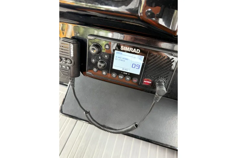 Kailani II Yacht Photos Pics Simrad marine radio on 2023 Cruisers Yachts 34 GLS OB dashboard.