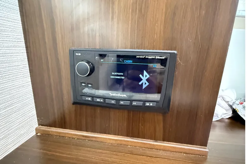 Kailani II Yacht Photos Pics 2023 Cruisers Yachts 34 GLS OB cabin Bluetooth stereo system display.