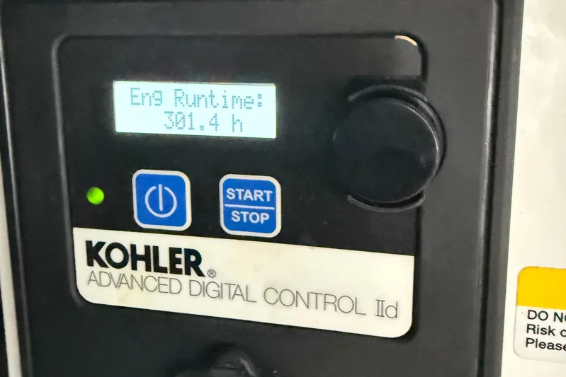 Kailani II Yacht Photos Pics Kohler digital control panel showing engine runtime of 301.4 hours on 2023 Cruisers Yachts 34 GLS OB.