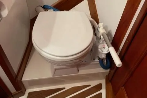 Trillium Yacht Photos Pics Hinckley Sou'wester 42 1987 marine toilet with manual pump in wooden interior.
