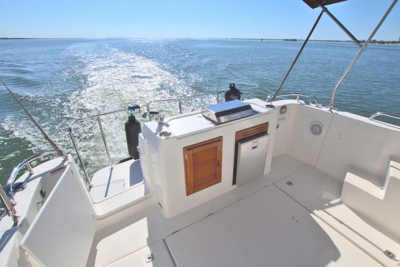  Yacht Photos Pics 2011 Ranger Tugs R-29 boat deck with ocean view and clear skies.