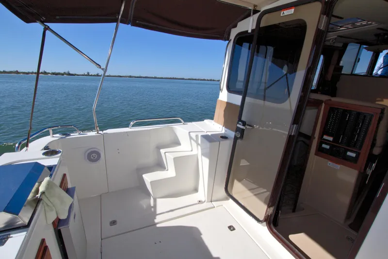  Yacht Photos Pics 2011 Ranger Tugs R-29 boat interior with open deck and water view.