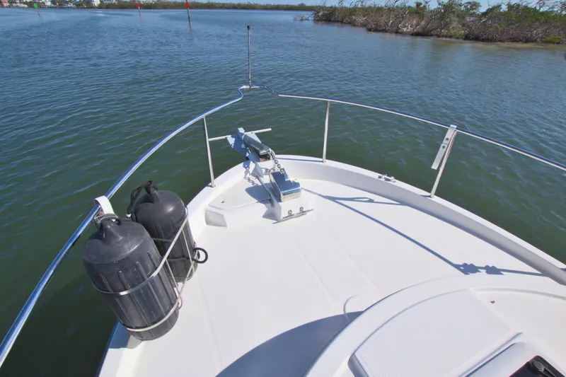  Yacht Photos Pics Bow view of 2011 Ranger Tugs R-29 on calm water.