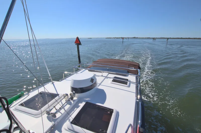  Yacht Photos Pics 2011 Ranger Tugs R-29 cruising on open water under clear blue skies.