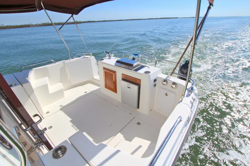 Yacht Photos Pics 2011 Ranger Tugs R-29 boat deck cruising on open water.