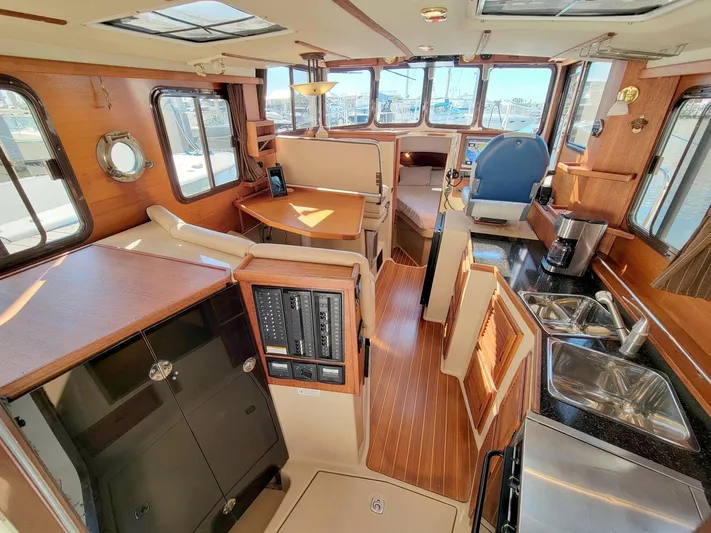  Yacht Photos Pics Interior of 2011 Ranger Tugs R-29 boat with wood finishes and modern amenities.