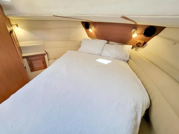  Yacht Photos Pics 2011 Ranger Tugs R-29 cabin interior with cozy bed and ambient lighting.