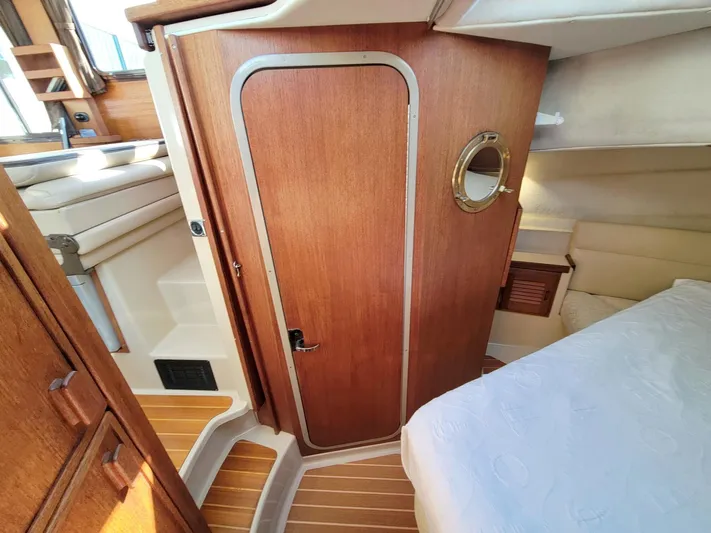  Yacht Photos Pics Interior of 2011 Ranger Tugs R-29 boat, featuring wood paneling and cozy cabin space.