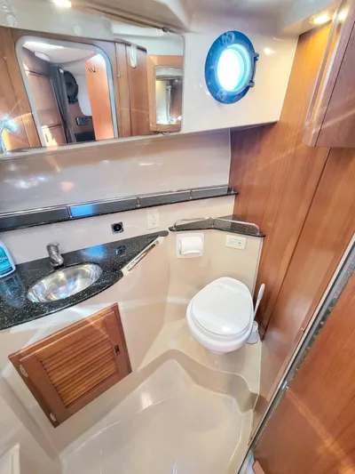  Yacht Photos Pics 2011 Ranger Tugs R-29 bathroom with sink, toilet, and porthole window.