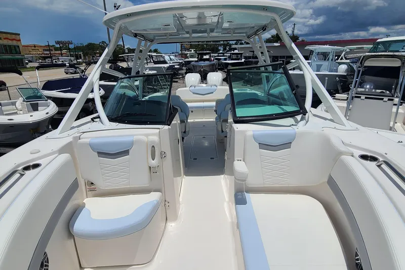  Yacht Photos Pics 2024 Robalo R317 Dual Console boat with spacious seating and modern design.