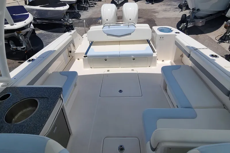  Yacht Photos Pics 2024 Robalo R317 Dual Console boat interior with seating and sink.