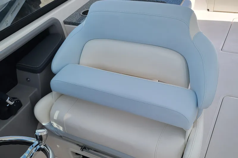  Yacht Photos Pics 2024 Robalo R317 Dual Console boat seat with light blue and white upholstery.