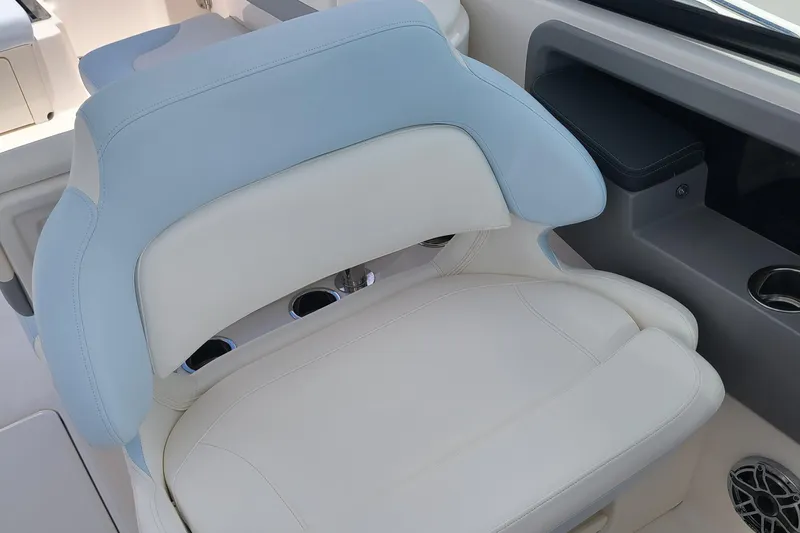  Yacht Photos Pics 2024 Robalo R317 Dual Console boat seat with light blue and white upholstery.