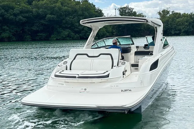 2018 Sea Ray 350 Slx @ Cancun Yacht Photos Pics 2018 Sea Ray SLX 350 boat cruising on a serene lake with lush greenery.