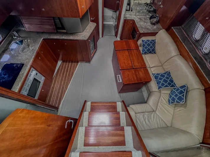  Yacht Photos Pics Luxurious 2008 Cruisers Yachts 460 Express interior with kitchen and cozy seating area.