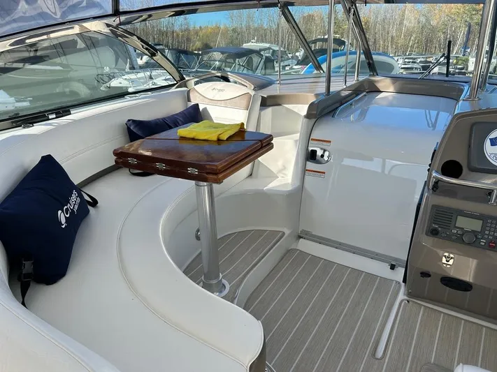  Yacht Photos Pics 2008 Cruisers Yachts 460 Express interior with seating, table, and navigation equipment.