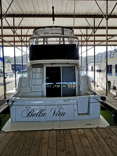  Yacht Photos Pics 2004 Carver 360 Sport Sedan yacht named "Bella Vita" docked in a marina.