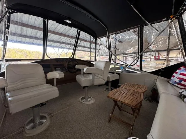  Yacht Photos Pics 2004 Carver 360 Sport Sedan interior with white seating and wooden table.