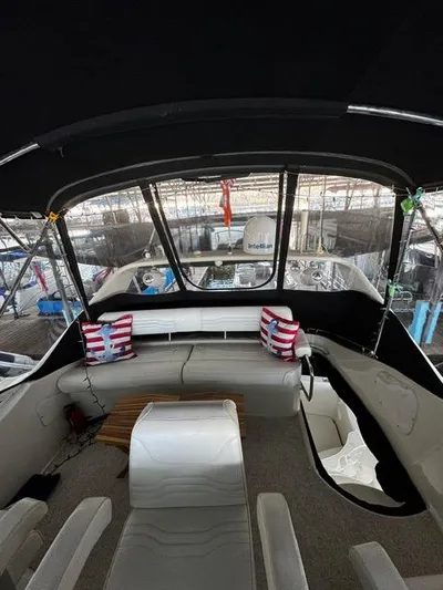  Yacht Photos Pics Interior view of 2004 Carver 360 Sport Sedan with seating and striped cushions.