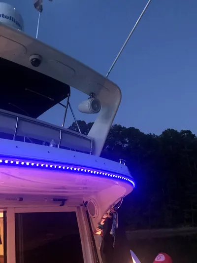  Yacht Photos Pics 2004 Carver 360 Sport Sedan with blue LED lights at dusk.