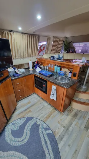  Yacht Photos Pics Interior of 2004 Carver 360 Sport Sedan with modern kitchen and cozy seating area.