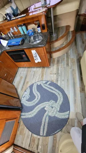  Yacht Photos Pics Interior of a 2004 Carver 360 Sport Sedan with wood flooring and nautical-themed decor.