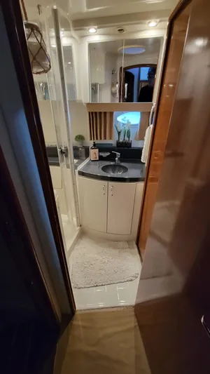  Yacht Photos Pics 2004 Carver 360 Sport Sedan bathroom with modern fixtures and compact design.