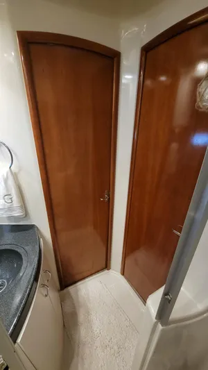  Yacht Photos Pics 2004 Carver 360 Sport Sedan interior with wooden doors and compact bathroom design.