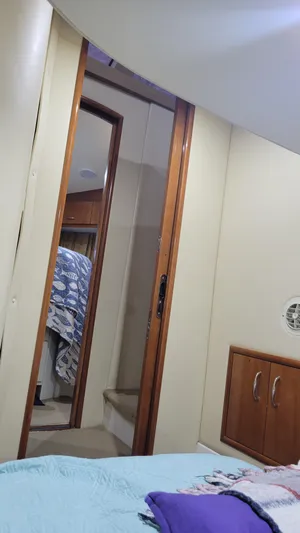  Yacht Photos Pics Interior of 2004 Carver 360 Sport Sedan with cozy bedroom and wooden cabinetry.