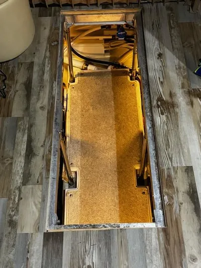  Yacht Photos Pics 2004 Carver 360 Sport Sedan interior compartment with wooden flooring and storage space.