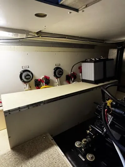  Yacht Photos Pics Engine room of a 2004 Carver 360 Sport Sedan with battery and control panels.