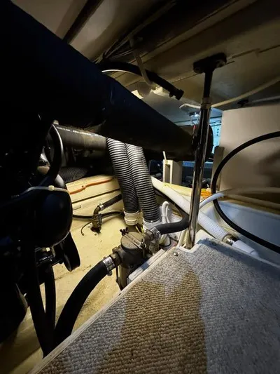  Yacht Photos Pics Engine room of a 2004 Carver 360 Sport Sedan with visible hoses and components.