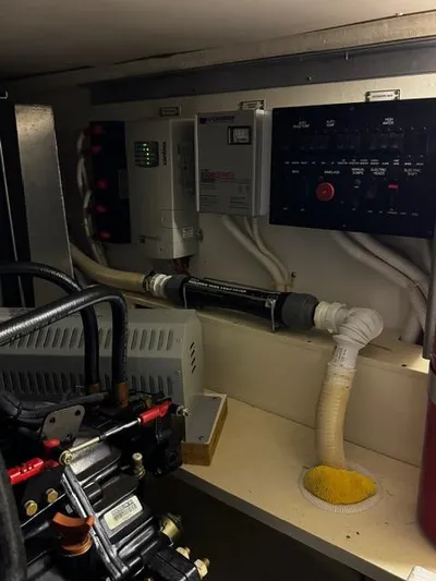  Yacht Photos Pics Engine room of a 2004 Carver 360 Sport Sedan with control panels and wiring.