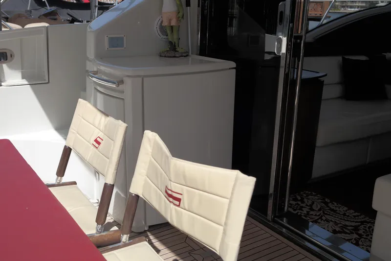 Fantasia 04 Yacht Photos Pics Interior of 2009 Azimut 43S yacht with chairs and table.