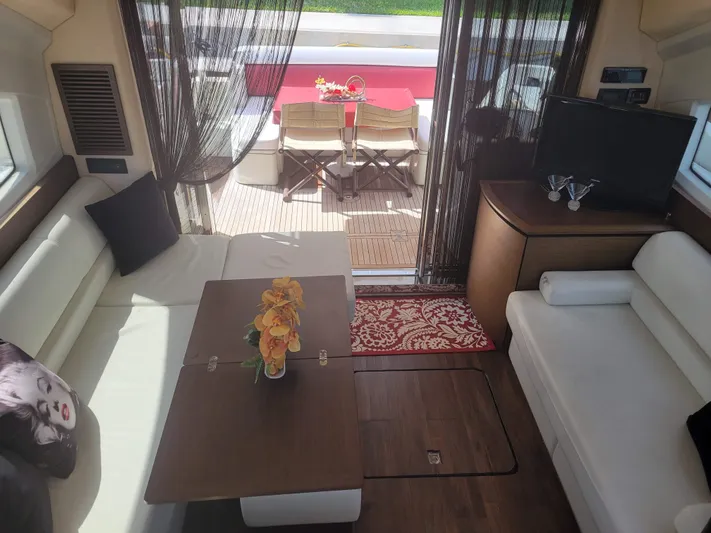 Fantasia 04 Yacht Photos Pics Interior of 2009 Azimut 43S yacht with elegant seating and outdoor dining area.