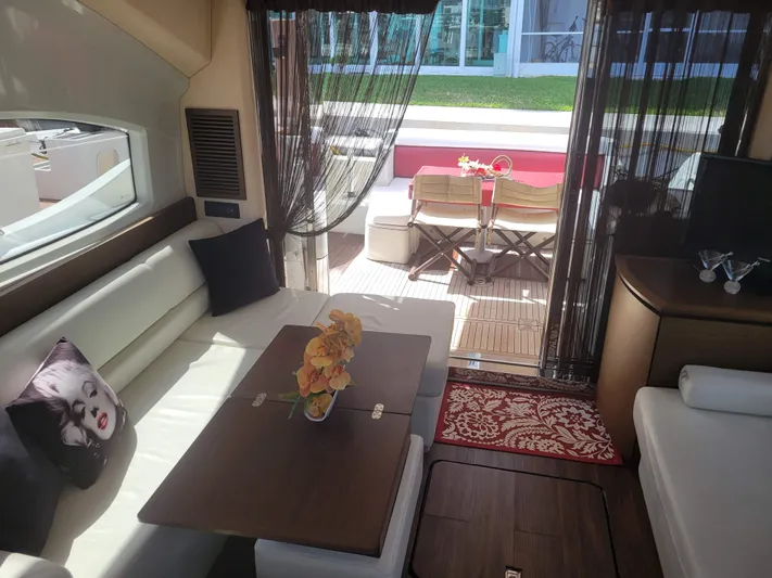 Fantasia 04 Yacht Photos Pics Interior of 2009 Azimut 43S yacht with elegant seating and table setup.