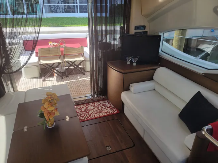 Fantasia 04 Yacht Photos Pics Interior of 2009 Azimut 43S yacht with elegant seating and outdoor dining area.