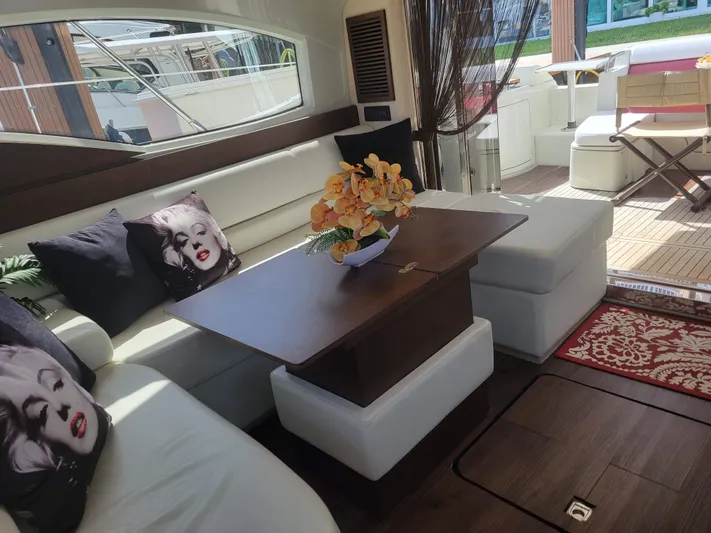 Fantasia 04 Yacht Photos Pics Luxurious interior of a 2009 Azimut 43S yacht with elegant seating and decor.