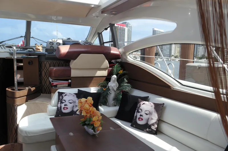 Fantasia 04 Yacht Photos Pics Luxurious interior of a 2009 Azimut 43S yacht with stylish decor and cityscape views.