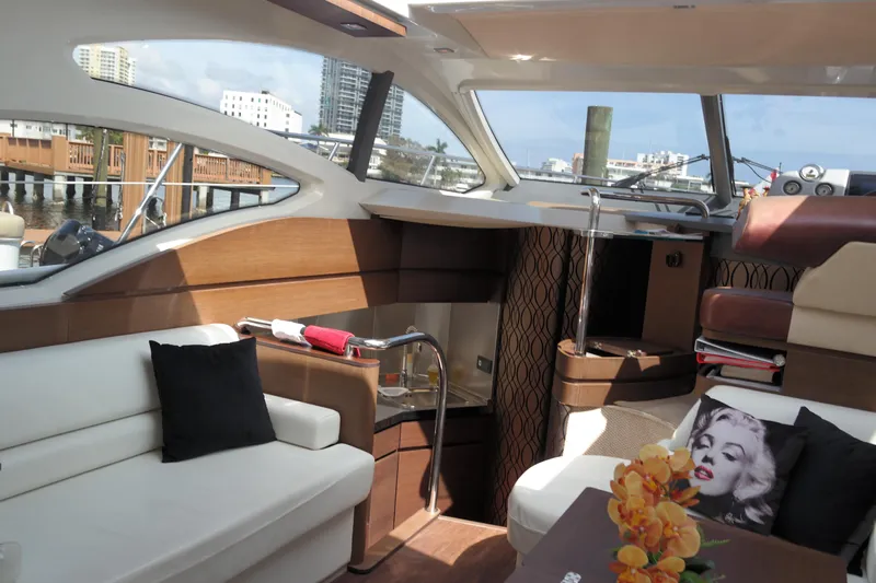 Fantasia 04 Yacht Photos Pics Luxurious interior of a 2009 Azimut 43S yacht with elegant seating and decor.