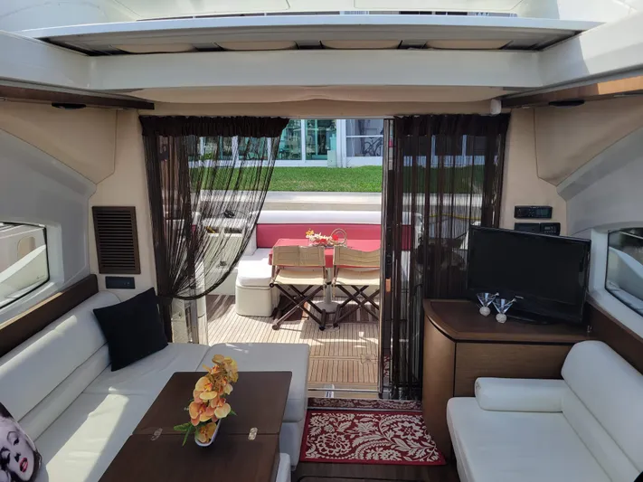 Fantasia 04 Yacht Photos Pics Luxurious interior of a 2009 Azimut 43S yacht with elegant seating and decor.