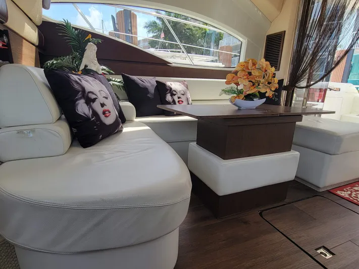 Fantasia 04 Yacht Photos Pics Luxurious interior of 2009 Azimut 43S yacht with elegant seating and decorative pillows.